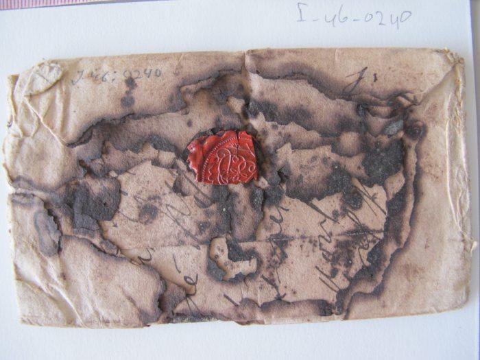 Antique burnt letter with wax seal